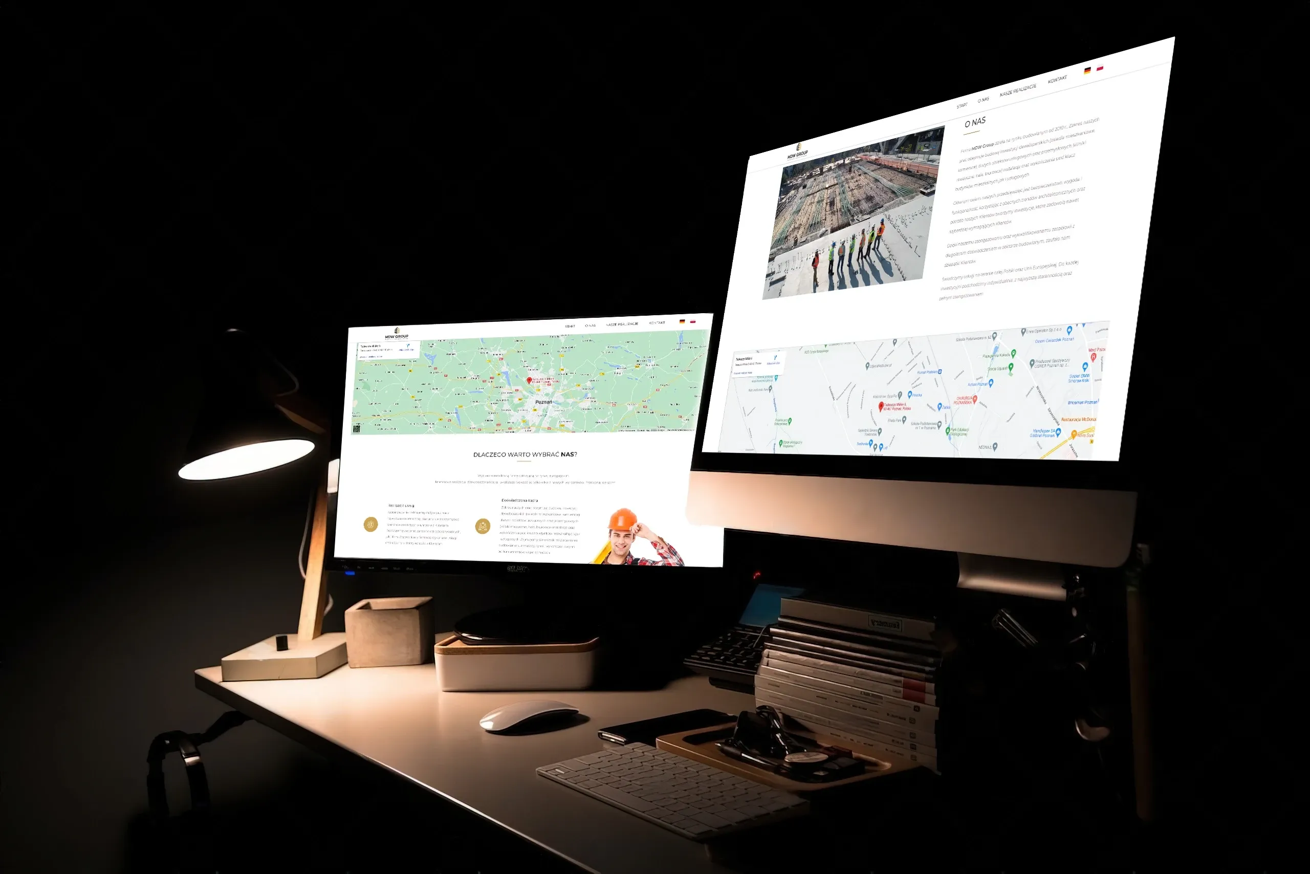 strona firmy budowlanej wyświetlana na 2 monitorach